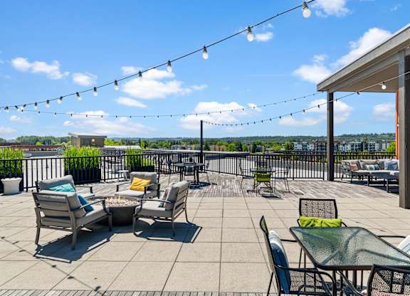 A patio with chairs and tables is set up for outdoor dining.