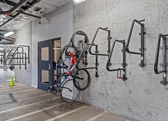 A bicycle is parked on a bike rack.