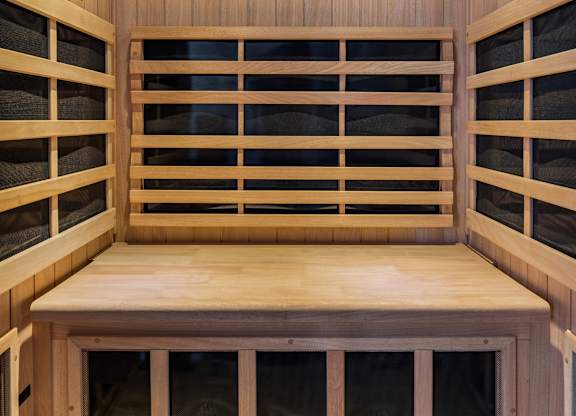 A wooden bench with windows on the sides.