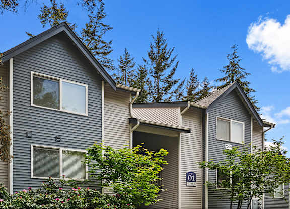 A grey house with a number 01 on the front.