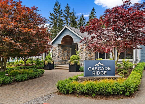 Cascade Ridge sign in front of a building with trees.