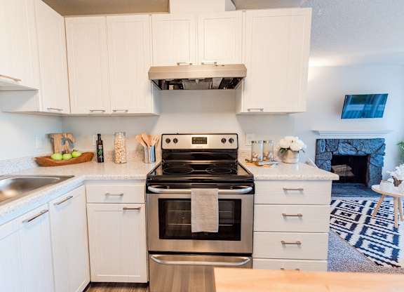 Kitchen with appliances at ReVive Apartments, Fife, Washington