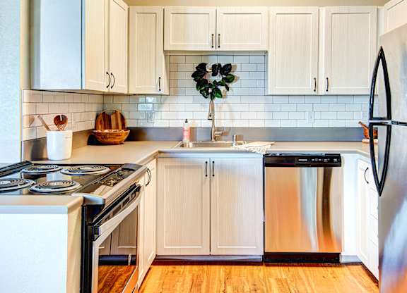 Everett Apartments The Lynx Kitchen with Stainless Steel Appliances at The Lynx Apartments, Everett, WA