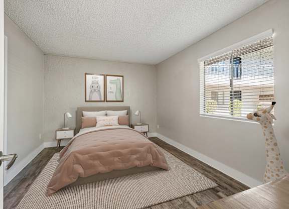 A bedroom with a bed, nightstands, and a window with blinds.