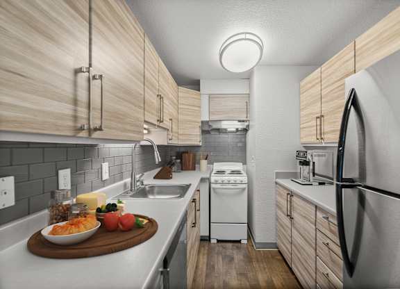 A modern kitchen with wooden cabinets and stainless steel appliances.