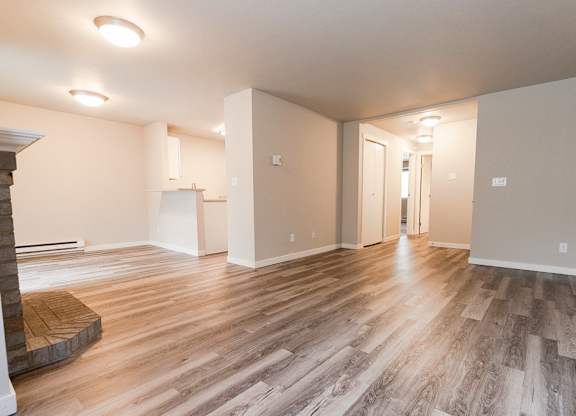 Living Room, Fireplace, Dining Room, Kitchen, and Entryway at Cambridge on Seventh, Puyallup