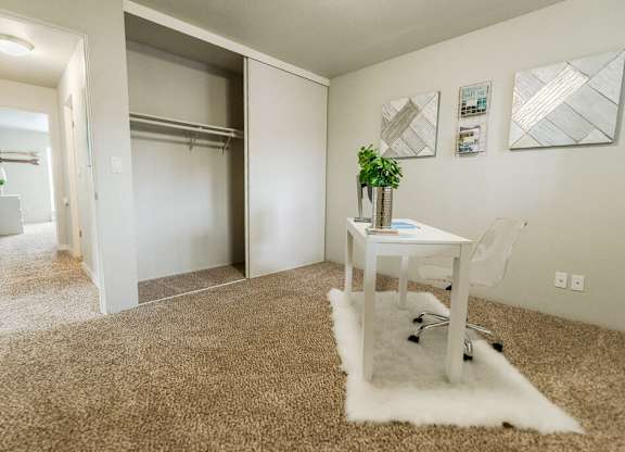 A room with a white desk and a white chair. at The Aviator, Renton, 98055