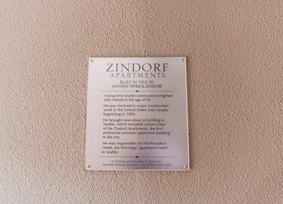 A plaque on a wall that says Zindorf Apartments. at Zindorf, Seattle, WA, 98104