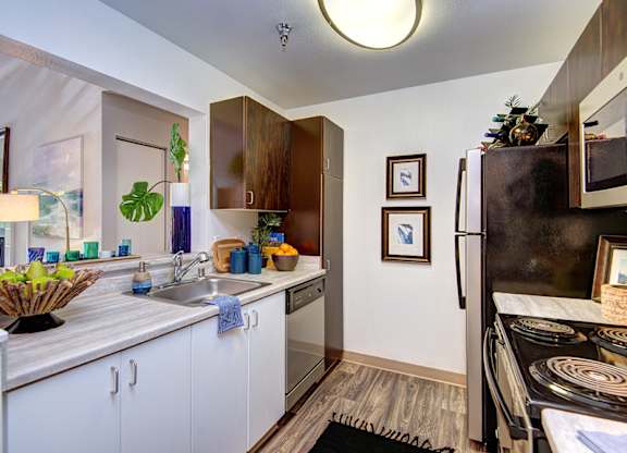Kitchen with Black Appliances at Signature Pointe, Kent, Washington
