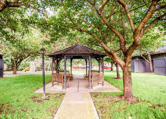 A gazebo is surrounded by trees and has a walkway leading to it. at The Retreat, Sumner, WA, 98390