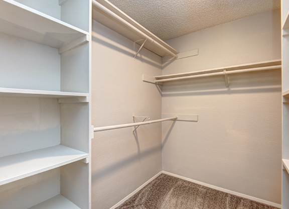 two pictures of a closet with white shelves and a hanger on the wall at The Lakes at Fife, Fife, WA, 98424