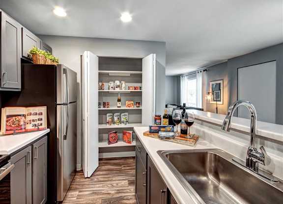 Kitchen with appliances at Deer Creek Apartments, Puyallup