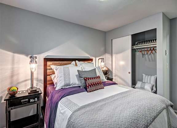 Bedroom with bed and lamp and ceiling light at Deer Creek Apartments, Washington, 98373