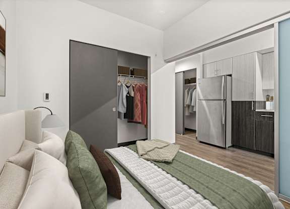 A bedroom with a bed and a wardrobe.
