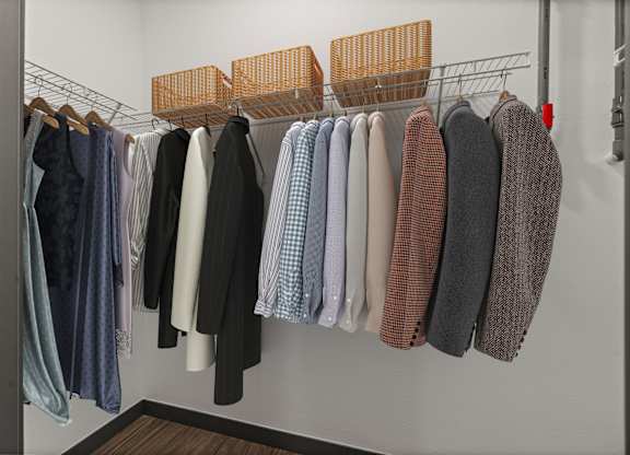 A row of clothes hanging on a rack.