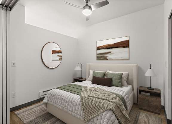 A bedroom with a bed, nightstands, and a painting on the wall.