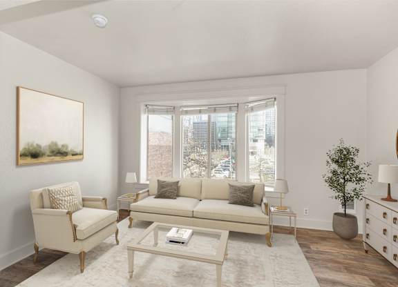 A living room with a beige couch, chair, and coffee table.