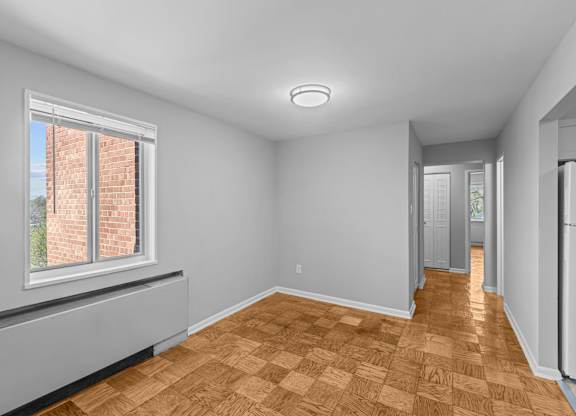 A room with a window and wooden flooring at Kensington House, Maryland
