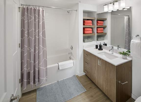 Modern bathrooms include soaking tubs with tile surround and built-in shelving