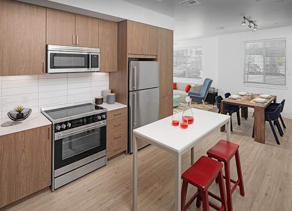 Luxury vinyl plank flooring is featured throughout all entry, kitchen, living/dining and baths