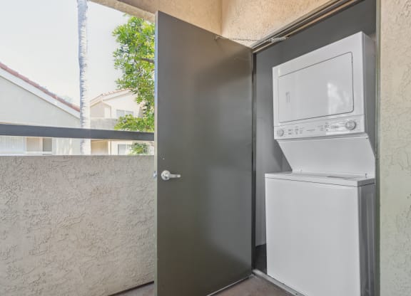 a washing machine and dryer on the side of a door