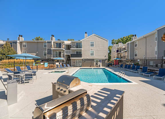 Huntington Apartments pool and BBQ grills and poolside seating
