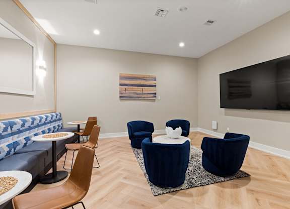 A living room with a blue couch and a television.