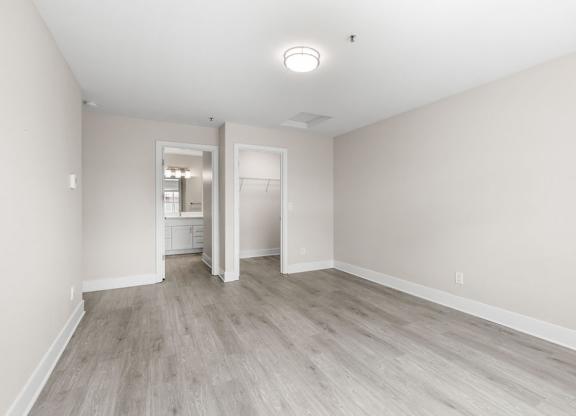 A room with a light grey floor and white walls.