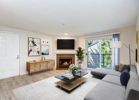 a living room with a fireplace and a tv above it