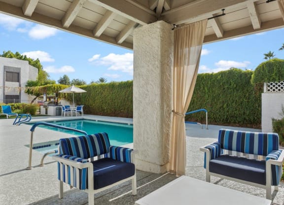 Del Sol Apartments Pool with Lounge Chairs