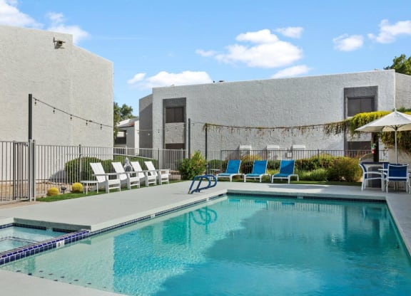 Del Sol Apartments Pool with Lounge Chairs
