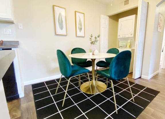 a dining room with a table and chairs