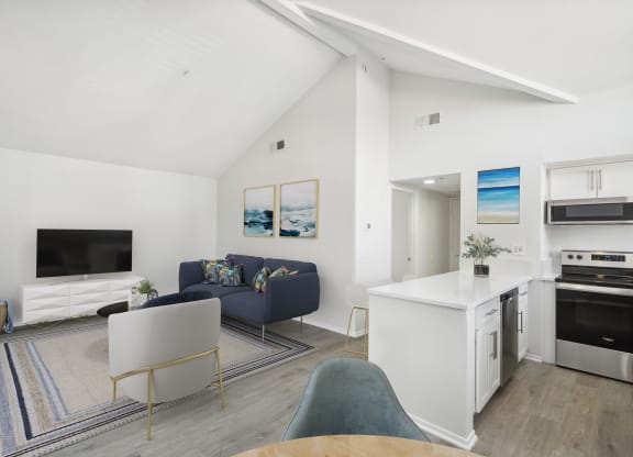 a view of the living room and kitchen from the dining area