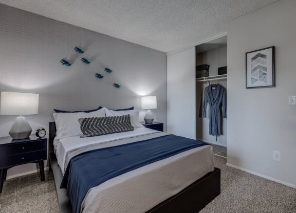 a bedroom with a bed and a nightstand