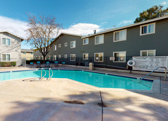 Aspire of the High Desert - Sparkling Pool Surrounded by Lounge Seating at Aspire High Desert Apartments, Victorville, CA