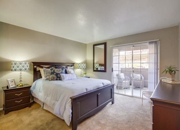 One-Bedroom Apartments in Temecula, CA- Vista Promenade- Wall-to-Wall Carpeting with Entrance to Patio and Stylish Decor at Vista Promenade Apartments, Temecula, California