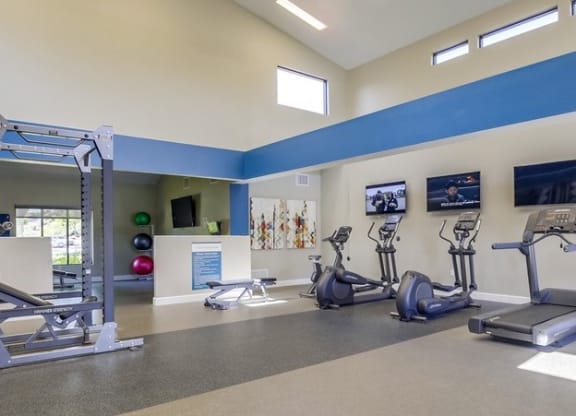 Fitness Center with treadmills, ellipticals, free weights, and more at Vista Promenade Apartments, Temecula, CA