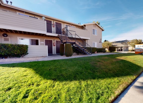 Exterior View of Apartment Building Surrounded By Lush Landscaping at Aspire High Desert Apartments, Victorville, 92392