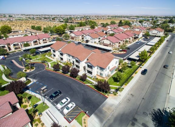 Building Showing Expansive Community and Green Landscaping at Riverton of the High Desert Apartments,Victorville, California