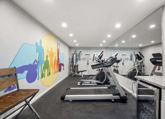 a gym with a colorful mural on the wall at Aspire Corona, Corona, CA