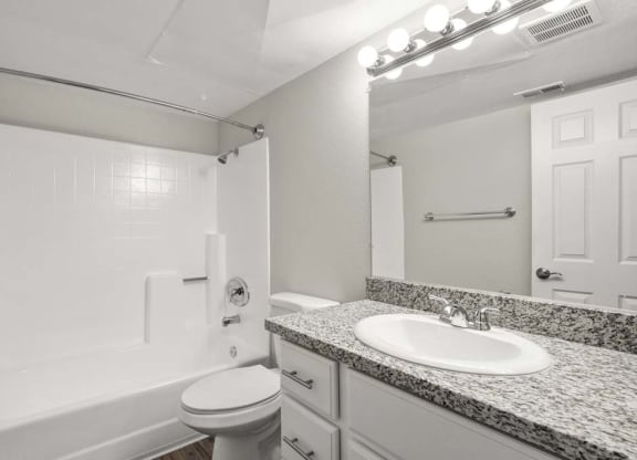 a bathroom with a sink toilet and bathtub at Aspire Corona, California, 92882