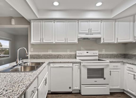 a kitchen with a sink stove and dishwasher at Aspire Corona, California, 92882
