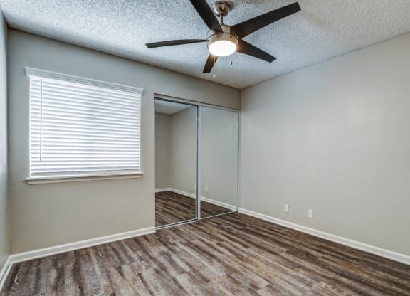 an empty room with a ceiling fan and a windowat Aspire Seneca, Victorville, 92392