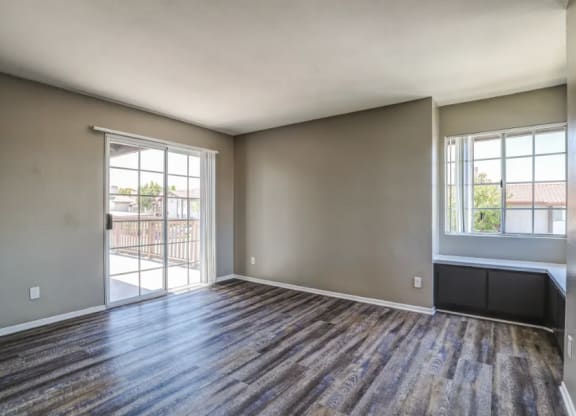 living room with wood flooring and a door to a balcony at Vista Promenade Apartments, Temecula, CA