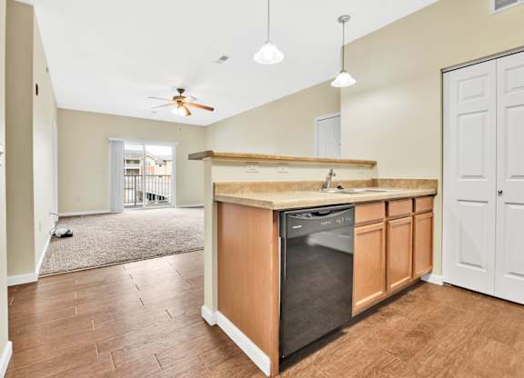A kitchen with a wooden counter and a black dishwasher. at Deer Valley Apartments, Illinois, 61282