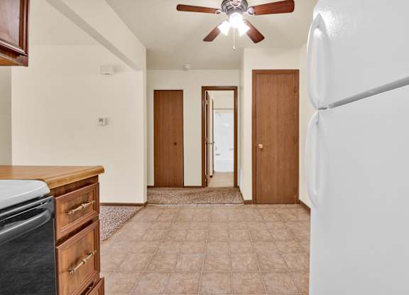 A kitchen with a refrigerator at Windsor Crest Apartments, Iowa, 52807