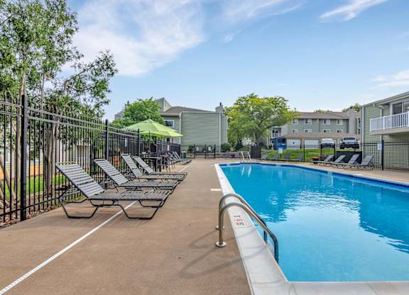 Pool With Lounge Chairs at Windsor Crest Apartments, Davenport