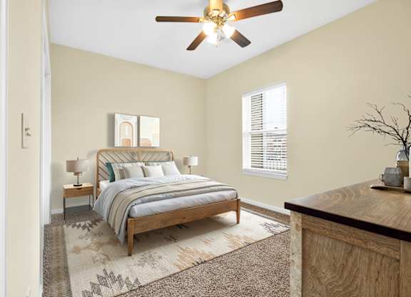 Bedroom With Ceiling Fan at Deer Valley Apartments, Silvis, IL