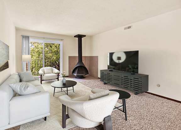 A living room with a fireplace and a television. at Indian Ridge Apartments, Davenport, IA