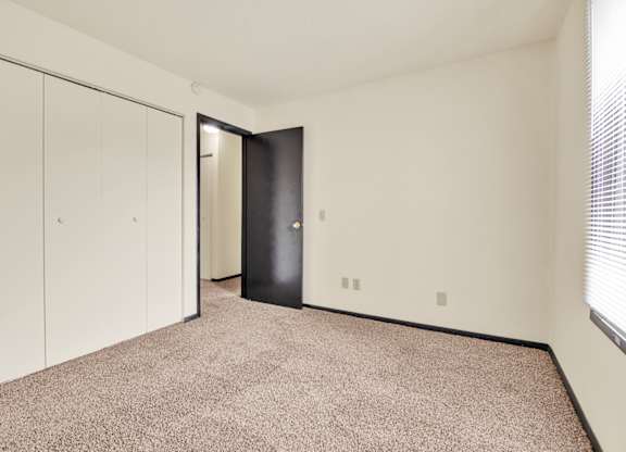 Bedroom With Closets at Indian Ridge Apartments, Iowa